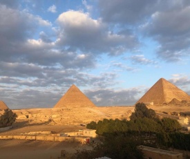 Sphinx palace pyramids view